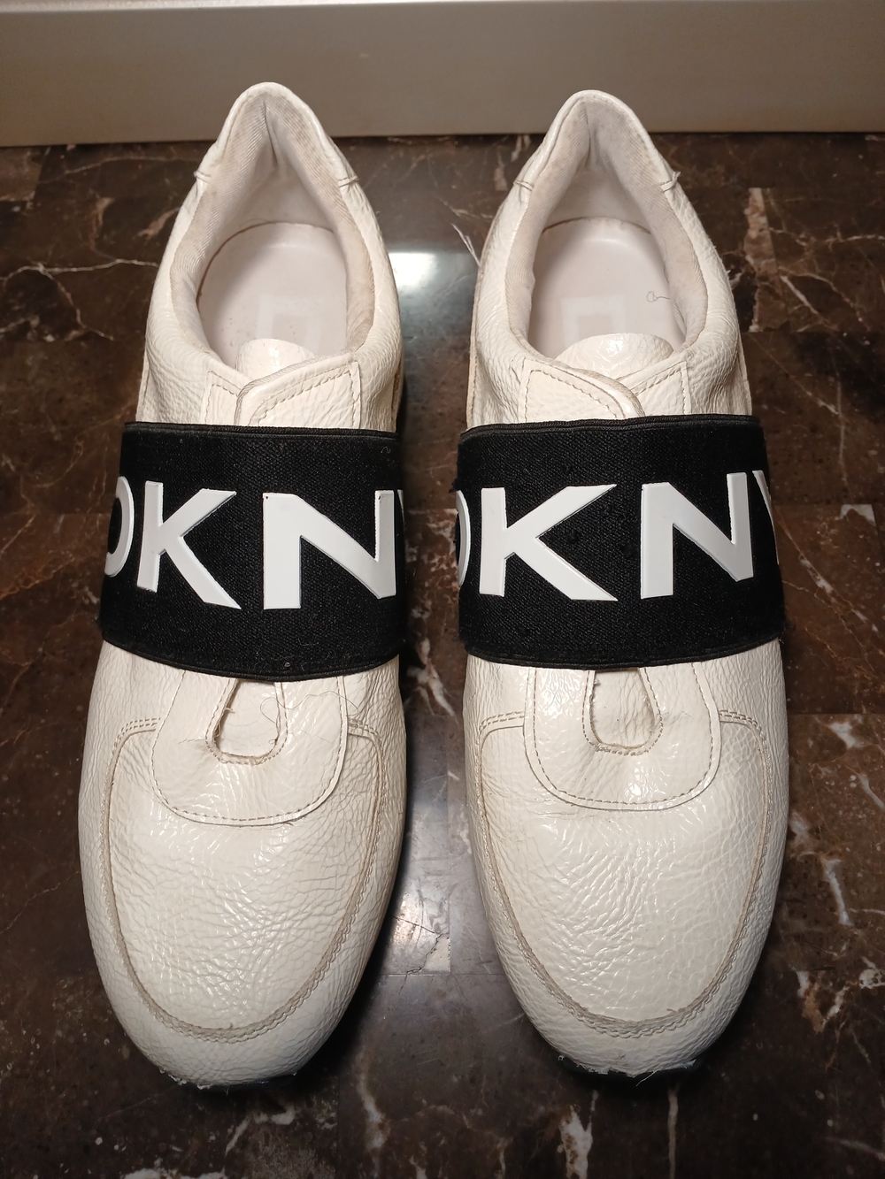 DKNY White Leather Slip-On Sneakers with Black Logo Strap